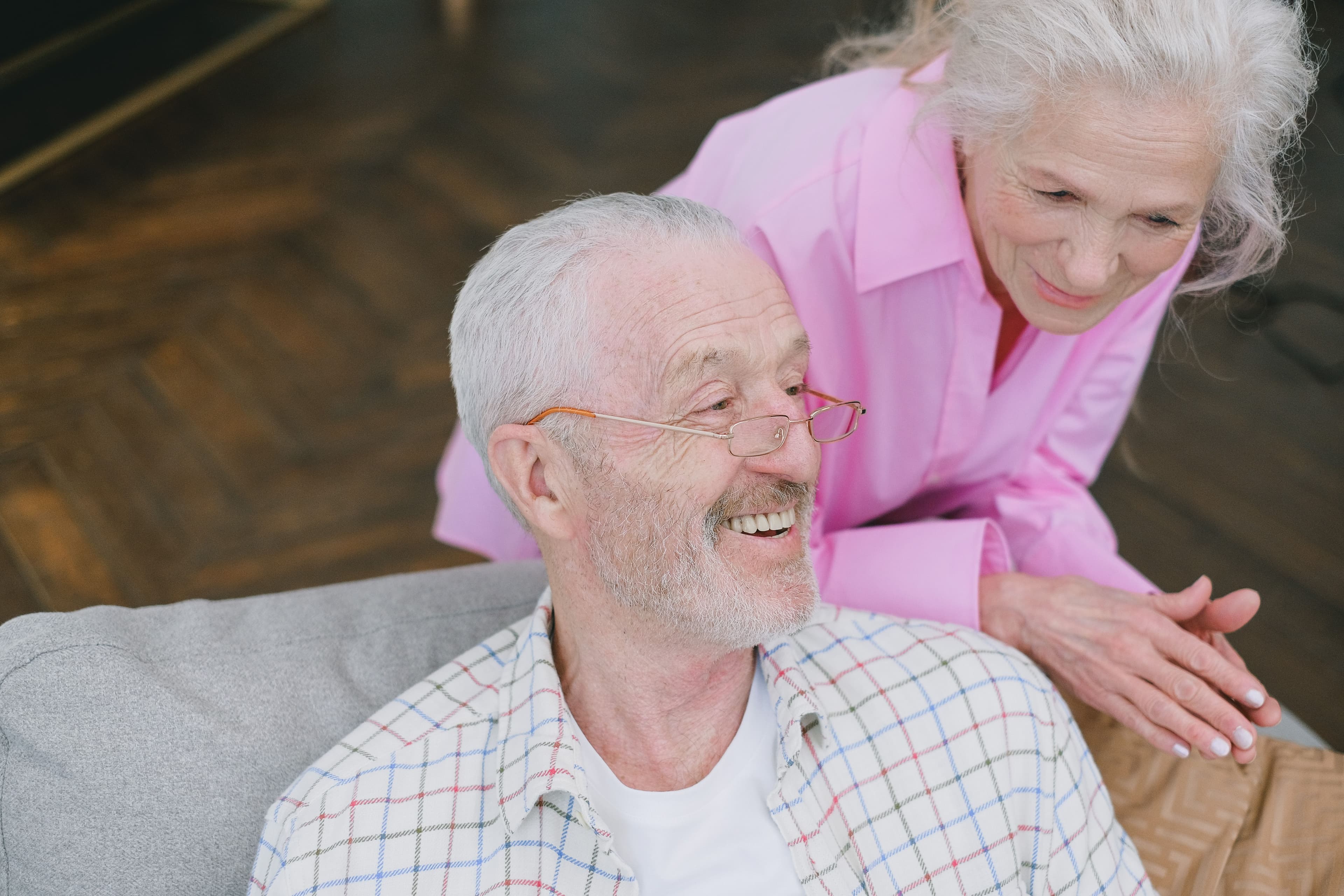 Older couple smiling at home